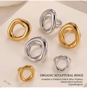 Detailed view of hollow irregular geometric gold and silver rings in various sizes