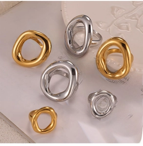 Detailed view of hollow irregular geometric gold and silver rings in various sizes