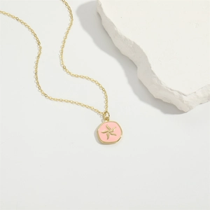 Elegant gold necklace with pink enamel star pendant and dainty link chain jewelry
