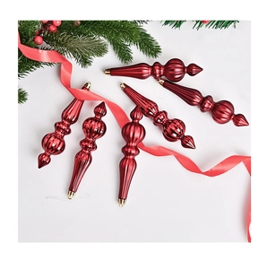 Detailed view of six red striped cone Christmas ornaments with festive pine and red ribbon