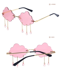 Cloud-shaped rimless pink sunglasses with gold frames and raindrop tassel details