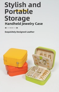 Detail of portable jewelry organizer showing compact interior storage with mirror and sections