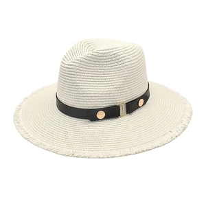 Close-up of beige straw Fedora with black leather band and gold metal hardware