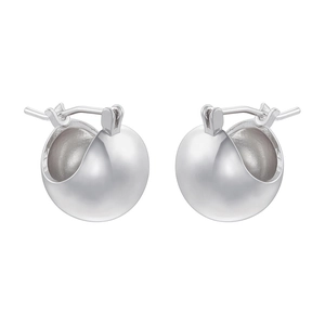 Detailed macro view of silver spherical huggie hoop earrings with a matte texture finish