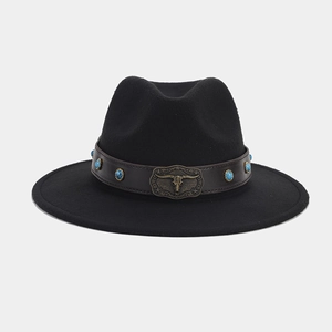 Detail of black fedora hat featuring a bull head metal buckle and turquoise beads strap