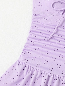 Detail of lavender eyelet embroidery swimsuit with ruffle hem and drawstring waist