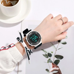 Close-up of a white and black digital sports watch with 5 ATM water resistance on wrist