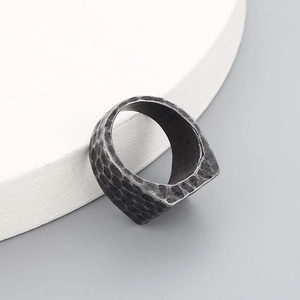Detailed macro view of the vintage hammered texture on this silver steel ring