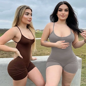 Outdoor shot showing back detail of slim fit backless jumpsuits in coffee and gray