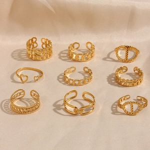 Set of nine golden minimalist open rings in various chain and heart designs