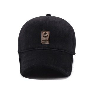 Men's winter baseball cap in black with ear flaps and mountain leather patch