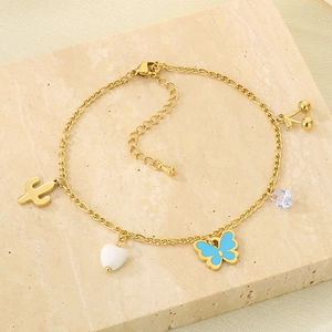 Detail of gold titanium steel anklet with cactus, blue butterfly and cherry charms