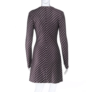 Back view of brown polka dot long sleeve mini dress with a slim fit waist design