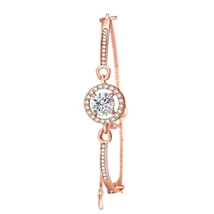 Close-up of rose gold bracelet featuring a large round crystal and pavé set stones