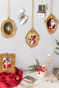 Detail of vintage gold Christmas tree ornaments with ornate baroque carved photo frames