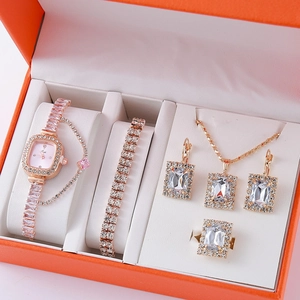 Elegant rose gold 5-piece jewelry set with watch and zircon crystals in an orange box