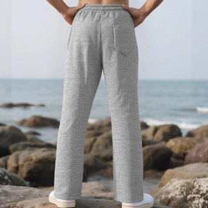 Men's vertical stripe casual wide-leg trousers in grey seen from a back outdoor view