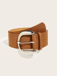 Detail of vintage brown suede wide belt with polished silver D-ring metal buckle