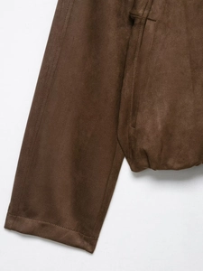 Detail of brown suede bomber jacket showing ribbed cuffs and elasticated hem stitching