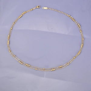 Double-layered gold beaded necklace in minimalist stainless steel with K18 engraving