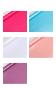 Detail shot of pearlescent gift wrapping paper in five elegant colors with soft luster