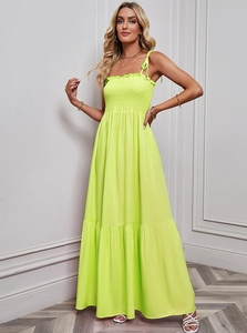 Neon green strapless maxi dress with pleated tube top and flowy large swing skirt