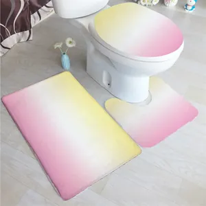 Dreiteiliges Badezimmerset mit gelb-rosa Farbverlauf-Badematten und WC-Sitzbezug