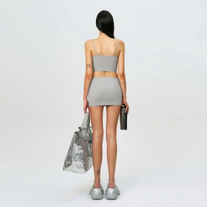 Rear view of grey ultra-short skirt and cropped camisole set with ruched texture