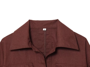 Detailed macro view of the reddish-brown shirt collar and woven fabric texture