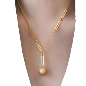 Elegant gold necklace featuring a frosted star-dust pendant and oval link chain