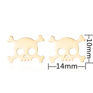 Detailed view of skull and crossbones stud earrings in gold with 14mm by 10mm dimensions