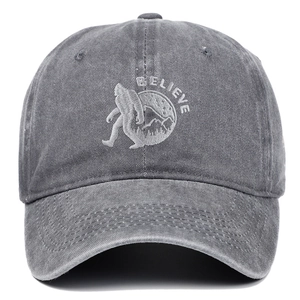 Close-up of BELIEVE embroidery and Bigfoot silhouette on a washed grey baseball cap