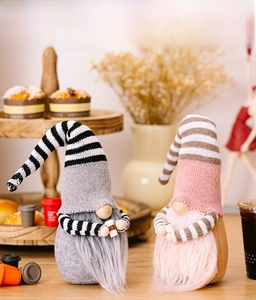 Detail of Christmas striped coffee gnomes with long beards on a cozy tiered tray