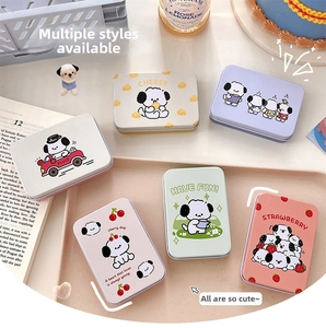 Detail of six colorful rectangle tin storage boxes with cute cartoon puppy illustrations
