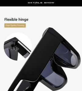 Detail of premium wide temple sunglasses featuring flexible hinges and quality black finish