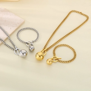 Set collana e bracciale a catena cubana in acciaio inox con ciondolo a sfera e chiusura OT