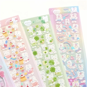 Detailed view of holographic laser stickers with cute rabbit, pudding and clover designs