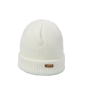 Detail of white knit beanie with a brown leather deer tag and ribbed texture