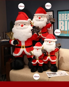 Comparison of Santa Claus plush toys in four sizes displayed on a sofa for Christmas décor