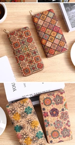 Detail of bohemian cork fabric wallets with ethnic patterns and floral print textures