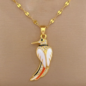 Detailed close-up of hummingbird necklace with colorful enamel and sparkling crystals