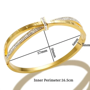 Crossed roman numeral gold bangle detail with crystals and 57mm x 50mm inner dimensions