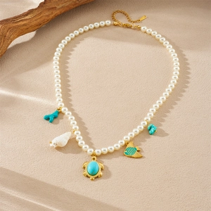 Tropical style pearl necklace with gold-plated sea turtle, fish and shell charms