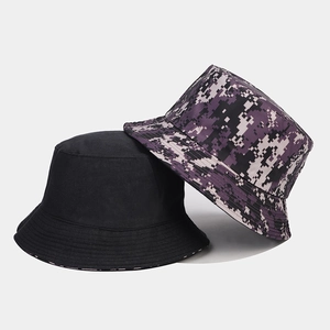 Close-up of a black canvas bucket hat and a purple digital camouflage sun hat