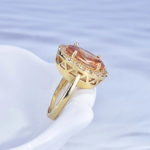 Luxurious 18k gold plated open ring with large oval orange gemstone and halo diamonds