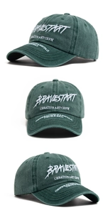 Detail of dark green washed cotton baseball cap with white 3D letter embroidery