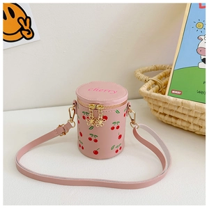 Detailed view of pink cherry bucket bag with embroidery and gold flower zippers