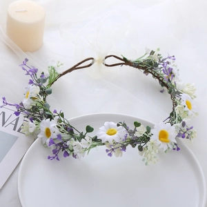 Close-up of handmade floral headband with white daisies and purple lavender on a plate