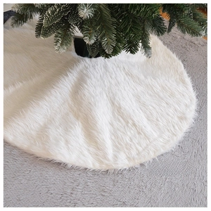 Detail showing the plush white faux fur texture of the Christmas tree skirt base decor