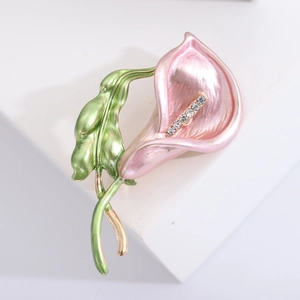 Detail of pink enamel morning glory brooch with green leaves and rhinestone stamen